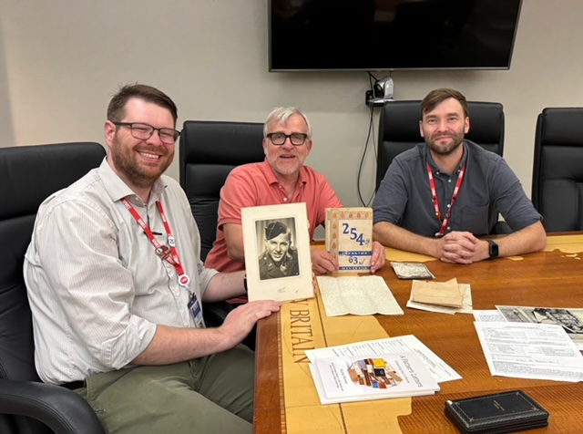 Murray Browne with curators Brandon Daake and Chase Tomlin at the World War II Museum in New Orleans
